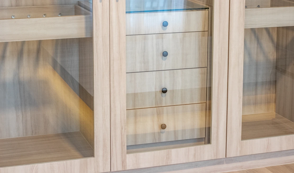 Wooden cabinet with glass doors and drawers