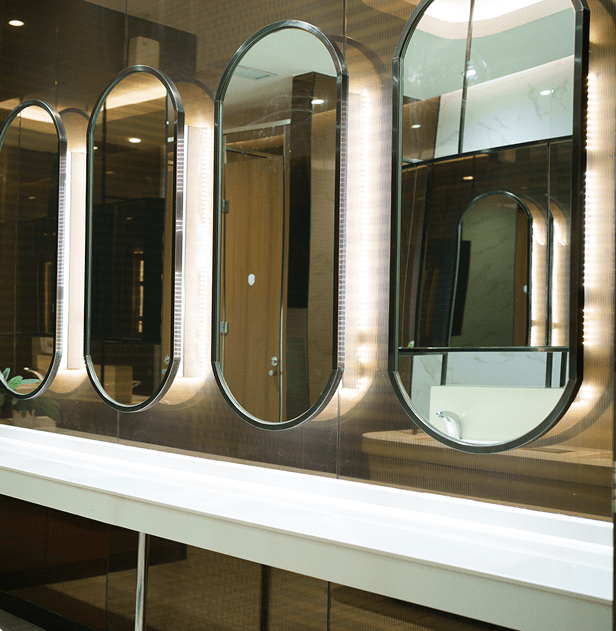 Elegant bathroom design with backlit mirrors
