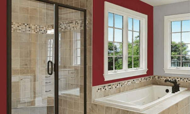 Elegant bathroom featuring large windows and tub